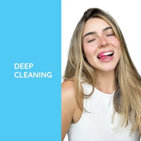 Woman using Gfloss hands-free floss for deep cleaning between teeth