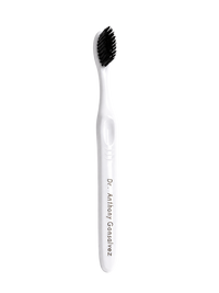 Customized toothbrush engraved with a doctor's name on the handle