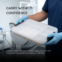 Clinician carrying a closed instrument tray with both hands in a clinic